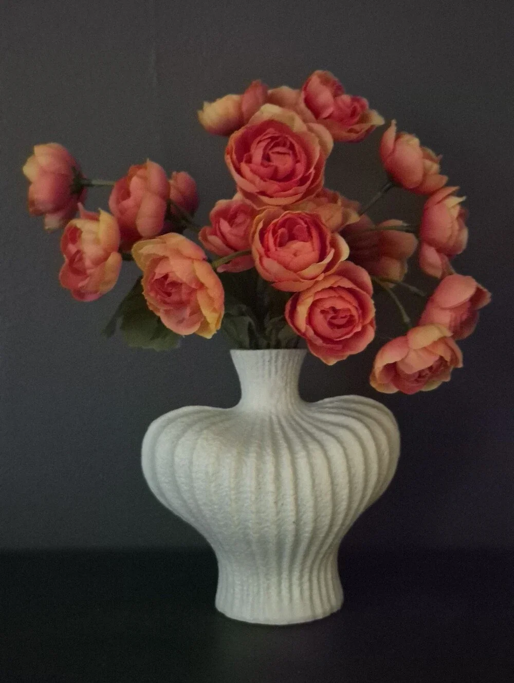 Ceramic white textured ribbed heart shaped vase w Orange ranunculus Flowers
